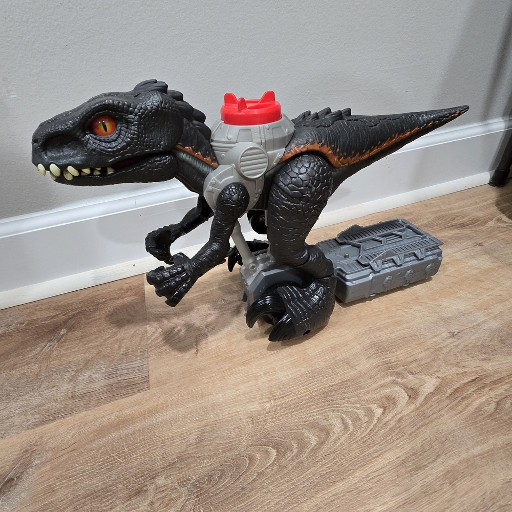 Black & Orange Toy Raptor Action Figure with Red Accent